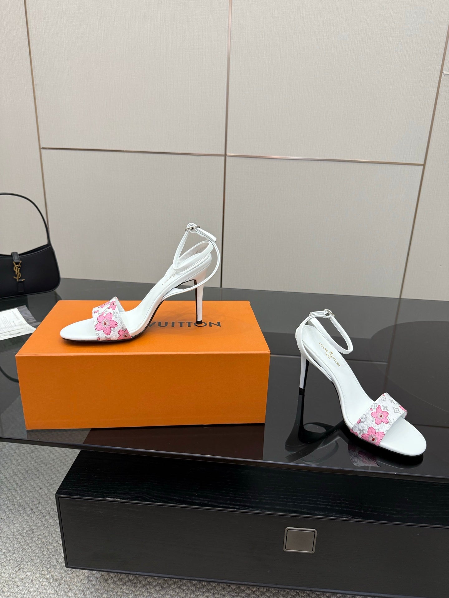 Women's white stiletto sandals with pink floral toe detail and slingback ankle strap
