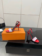 Louis Vuitton women’s red high-heel sandals with black footbed and floral LV toe band