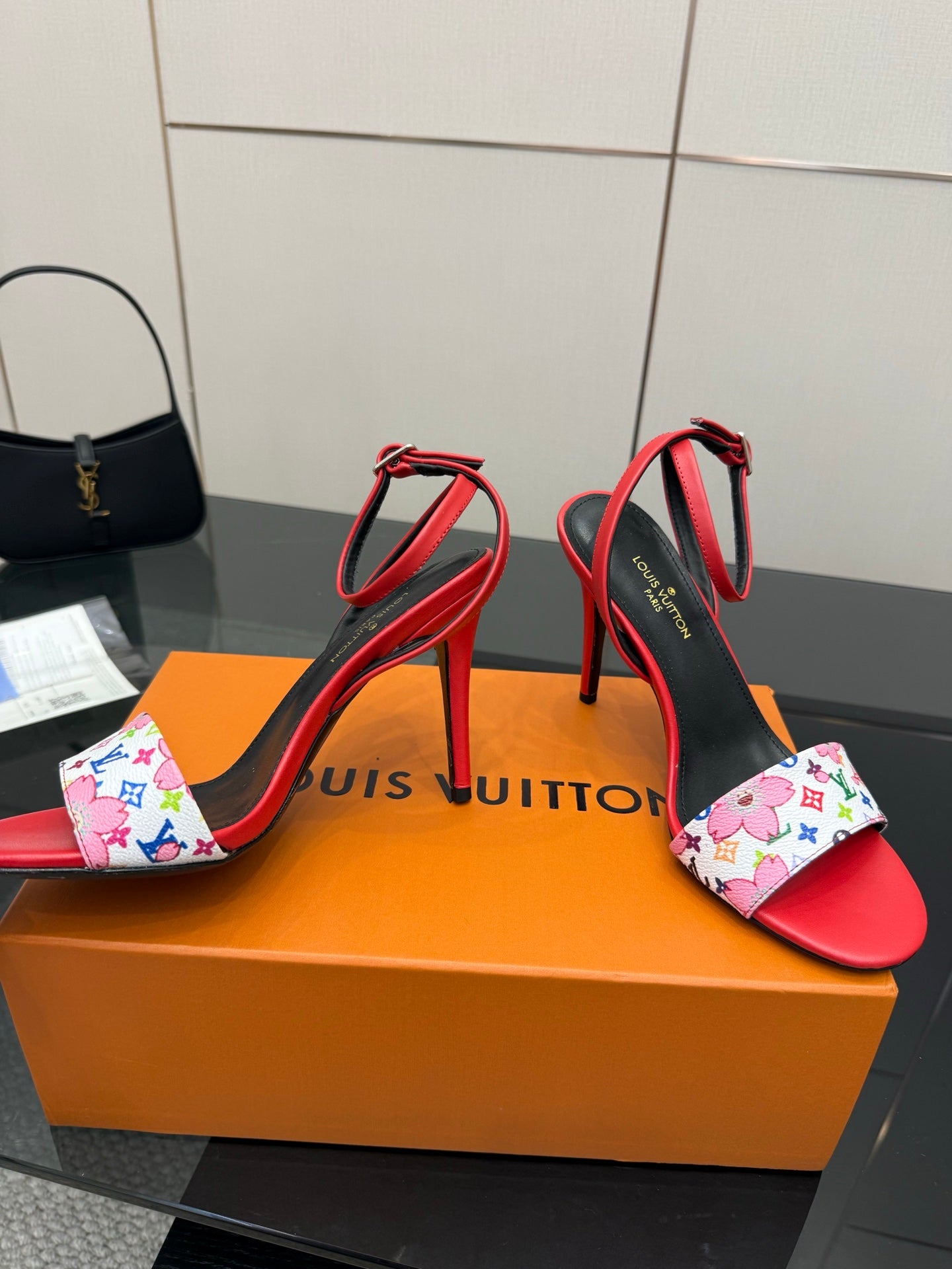 Louis Vuitton women’s red and black high-heel sandals with multicolor floral print strap detail