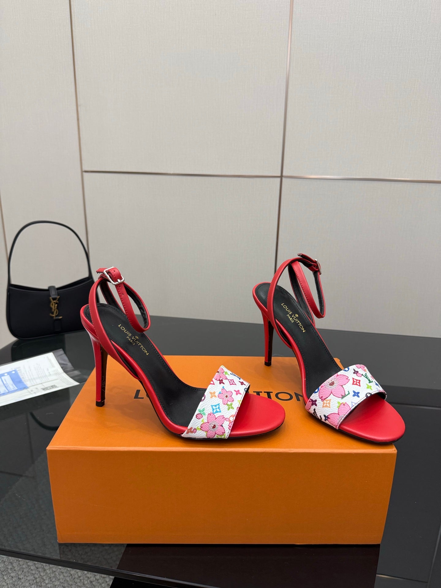 Louis Vuitton women’s red high-heel sandals with black straps and multicolor floral LV toe band
