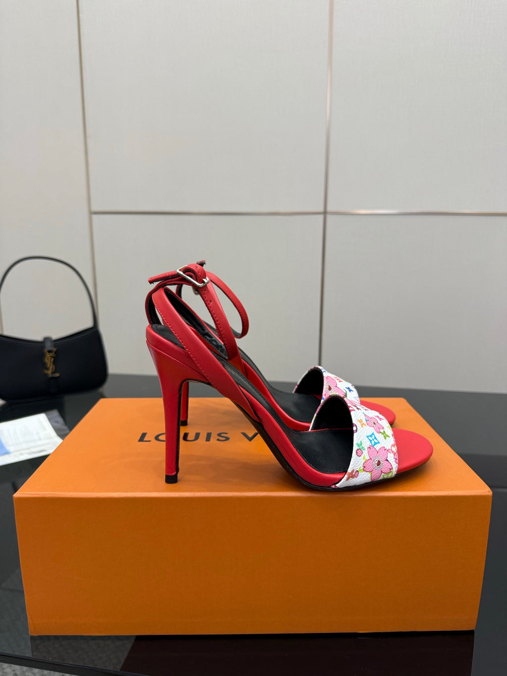 Louis Vuitton women’s red high-heel sandals with black heel strap and floral-pattern toe strap