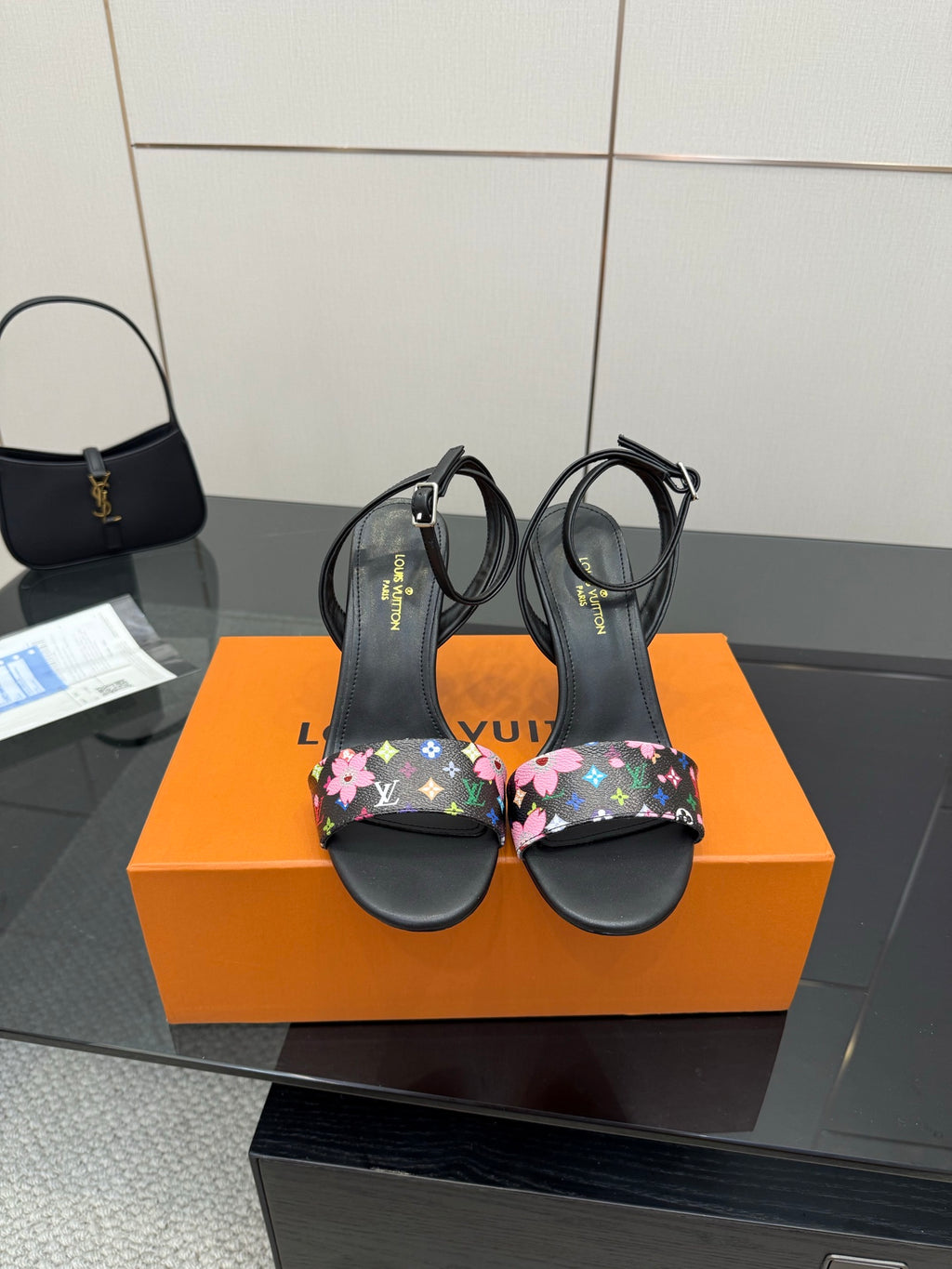 Black slingback heeled sandals with multicolor floral monogram straps, open toe