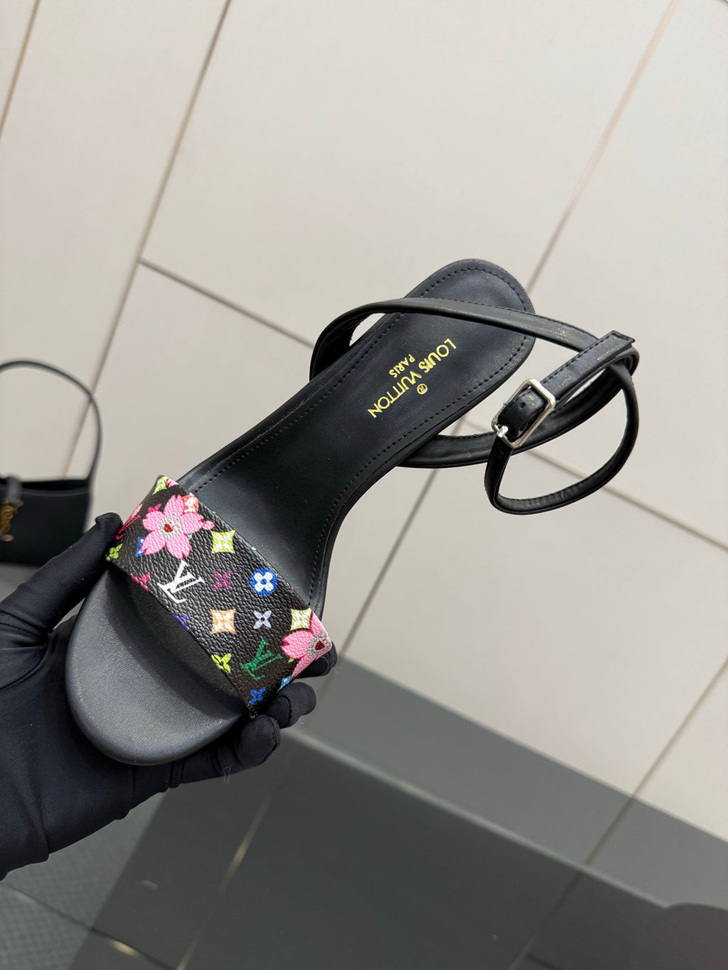 Black slingback sandal with multicolor floral monogram band and ankle strap
