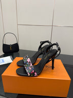 Black open-toe stiletto slingback sandals with multicolor floral monogram strap