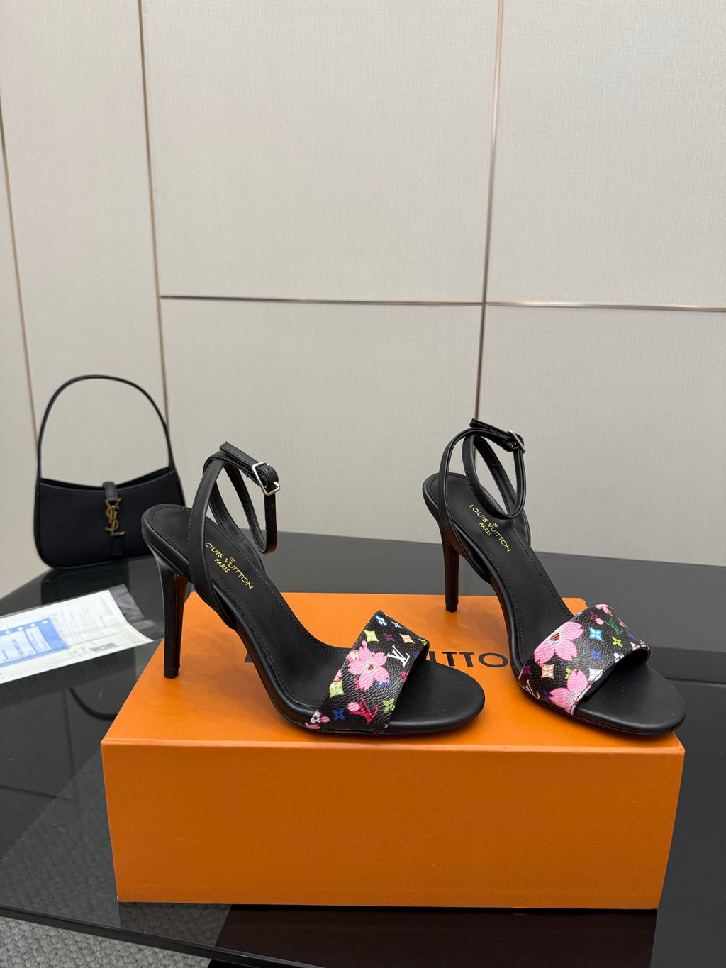 Black open-toe heeled slingback sandals with multicolor floral monogram straps