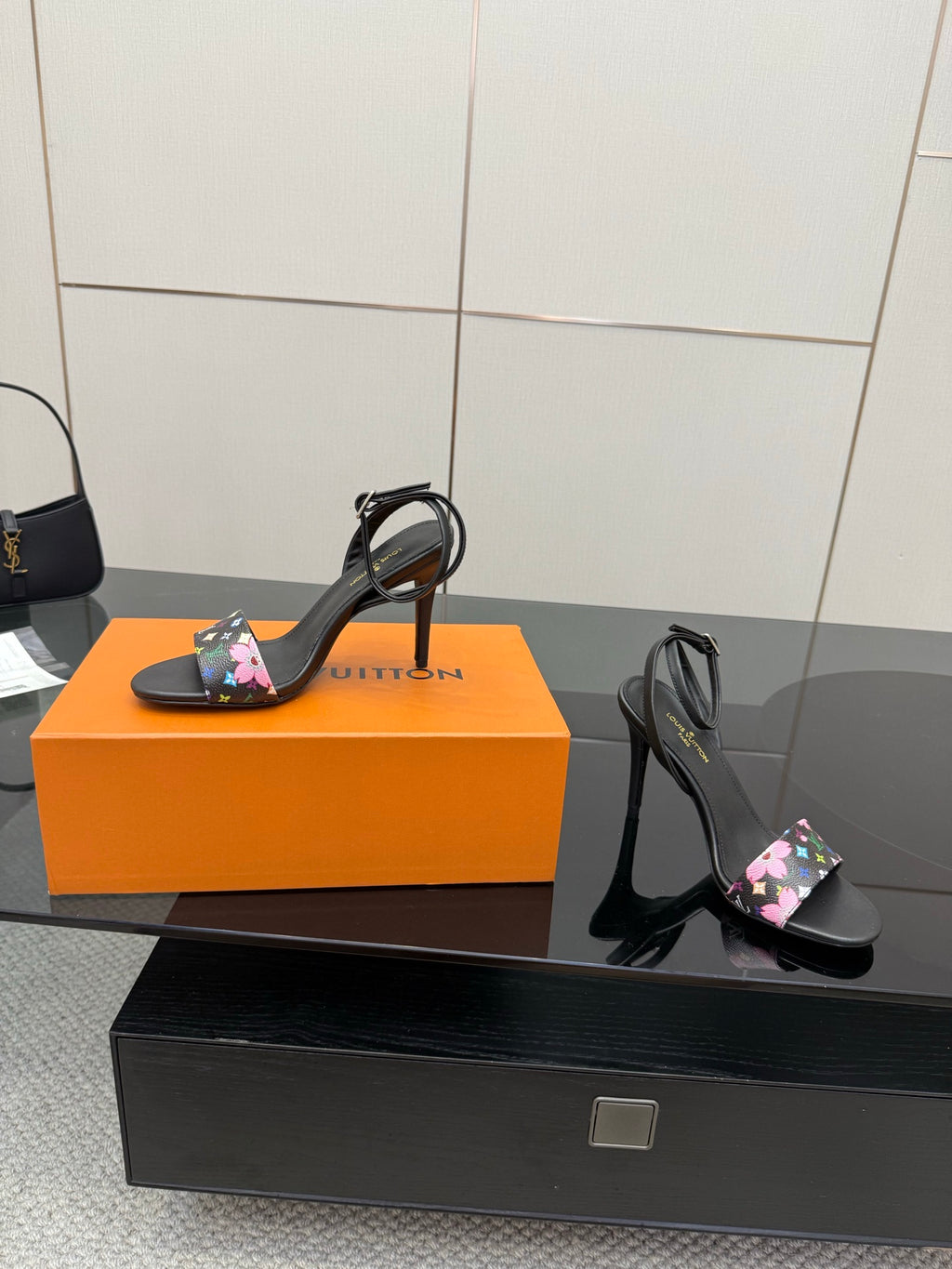 Black stiletto heeled sandals with multicolor floral monogram straps, open toe