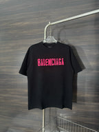 Black crewneck T-shirt with pink BALENCIAGA graphic on chest