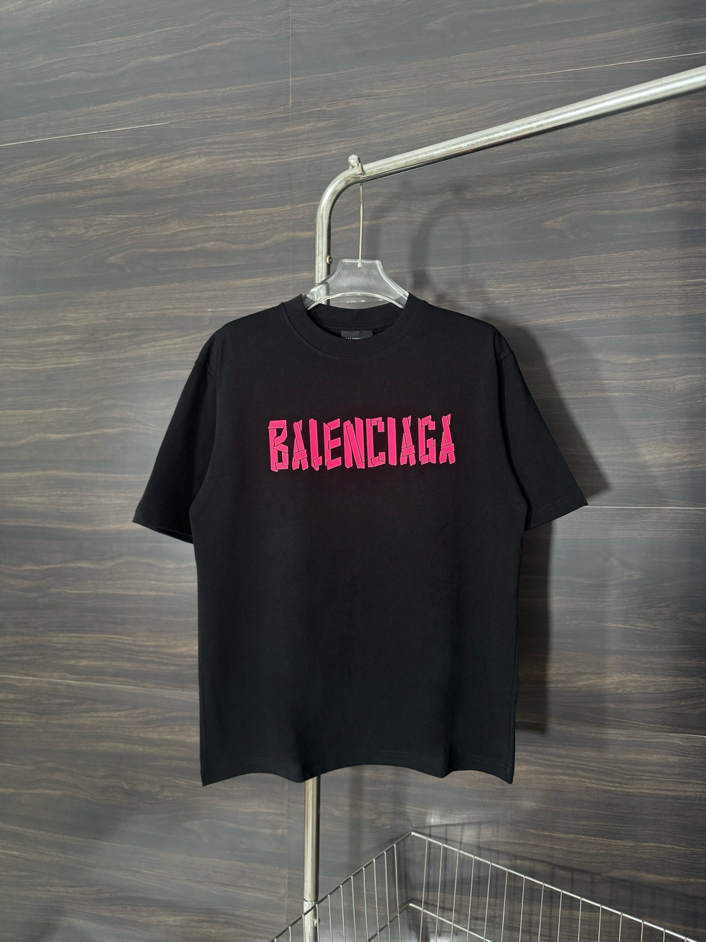Black crewneck T-shirt with pink BALENCIAGA graphic on chest