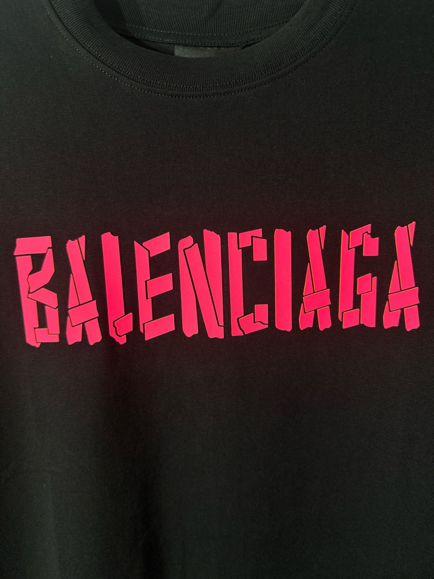 Black T-shirt with pink BALENCIAGA lettering
