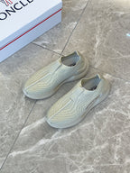 Moncler knit slip-on sneakers, light green, pair on floor with side logos