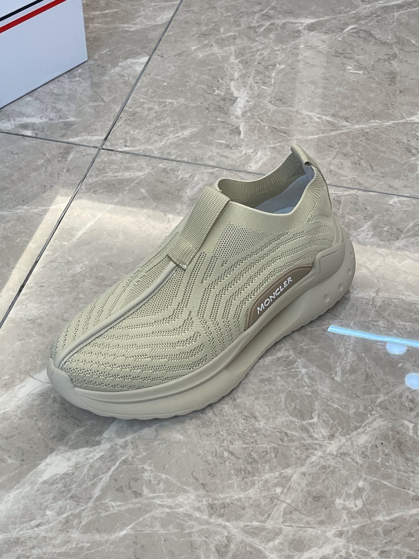 Moncler knit slip-on sneaker, light green, side profile with stitched detailing