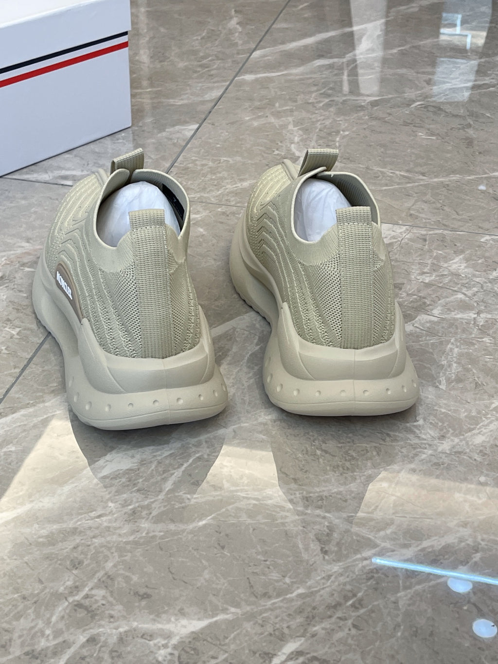 Moncler knit slip-on sneakers, light green, heel view of both shoes