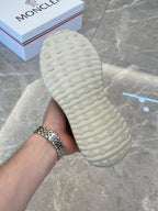Moncler slip-on shoe sole, light green textured tread, close-up