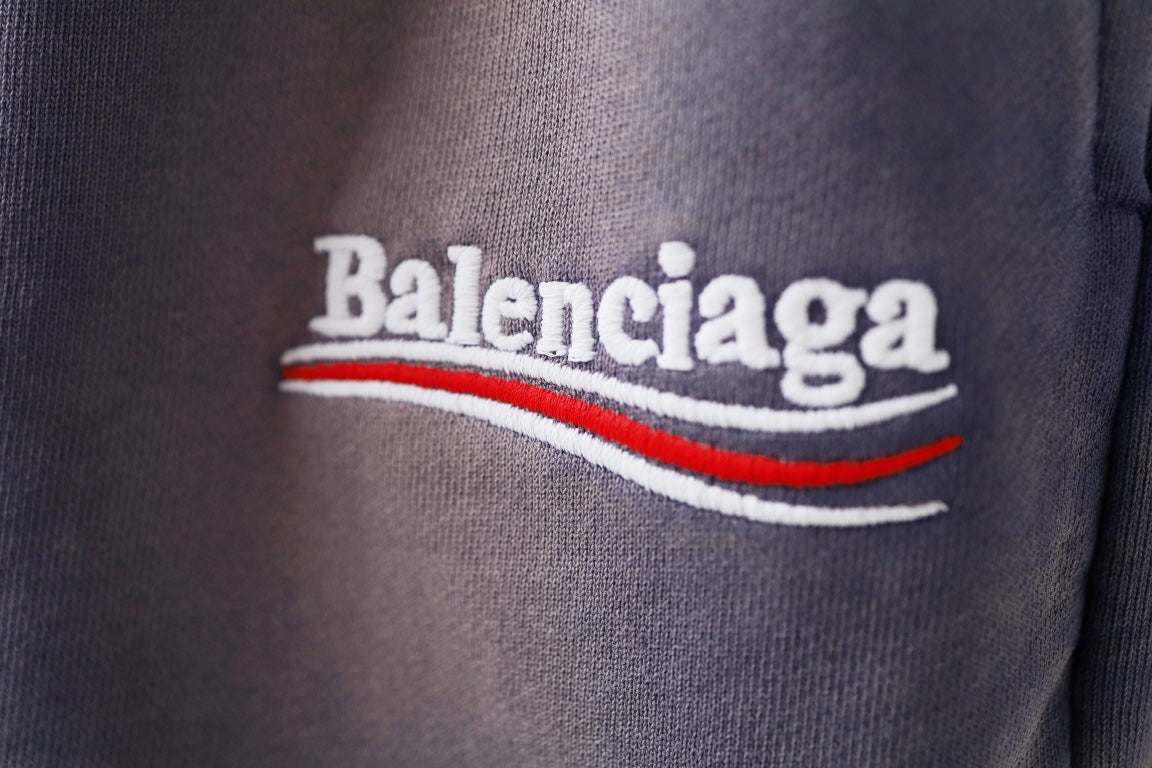 Balenciaga lavender shorts close-up of large 'Balenciaga' logo