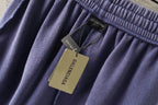 Balenciaga lavender shorts with hanging price tags on elastic waistband