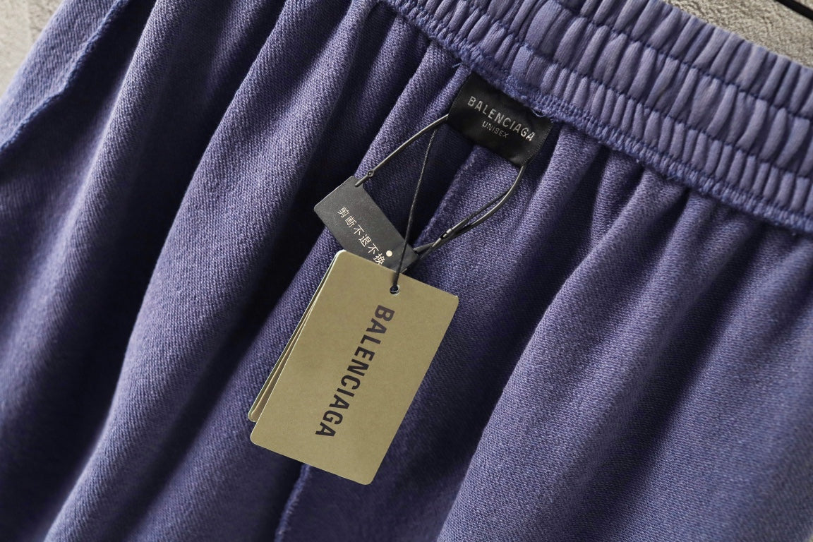 Balenciaga lavender shorts with hanging price tags on elastic waistband