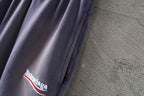 Balenciaga lavender shorts leg with 'Balenciaga' logo embroidery
