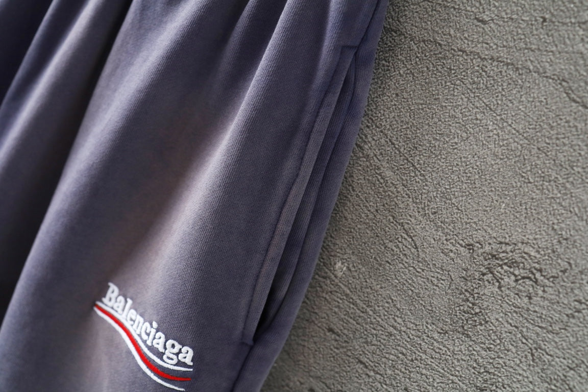 Balenciaga lavender shorts leg with 'Balenciaga' logo embroidery
