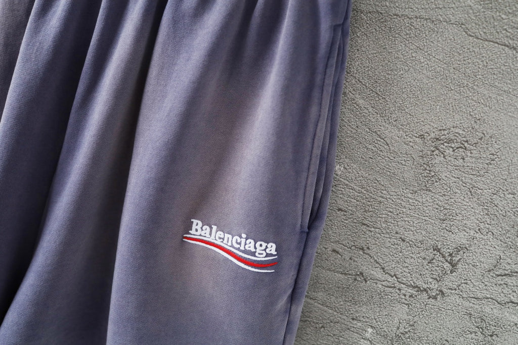 Balenciaga lavender shorts with small embroidered 'Balenciaga' logo on leg