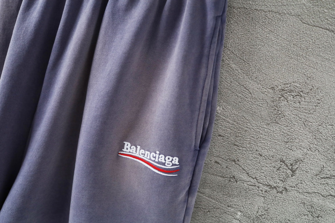 Balenciaga lavender shorts with small embroidered 'Balenciaga' logo on leg