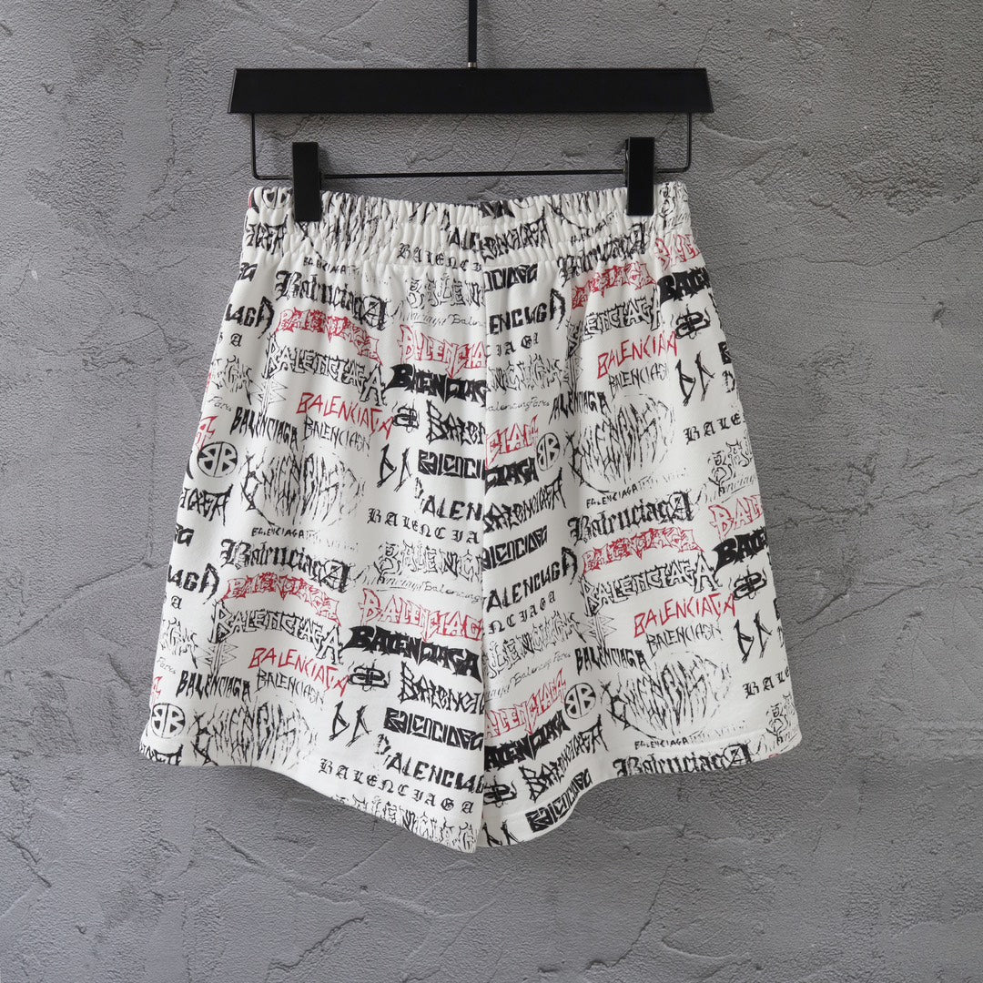 White printed shorts with black and red repeating logo text, elastic waist