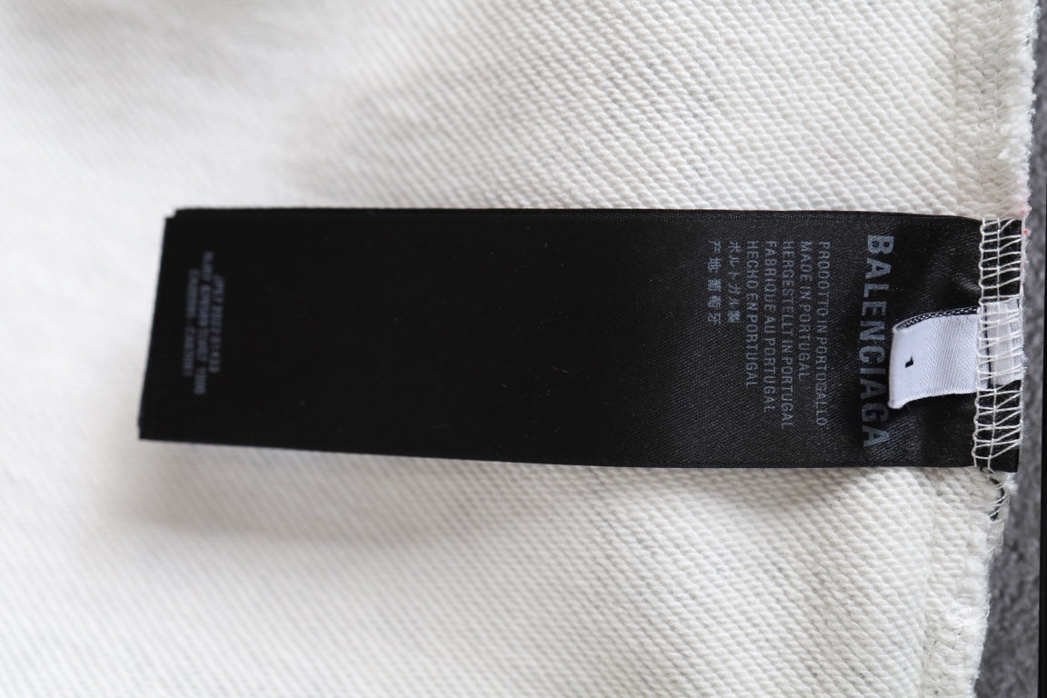 Balenciaga inner size label on white shorts seam