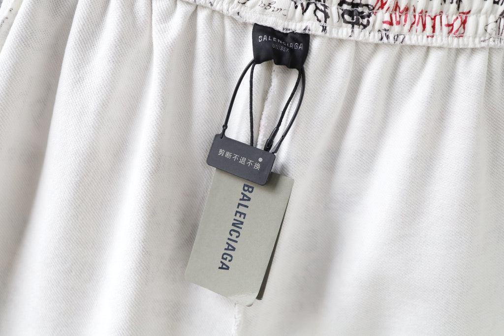 Balenciaga shorts with gray brand tag and black drawcord, white