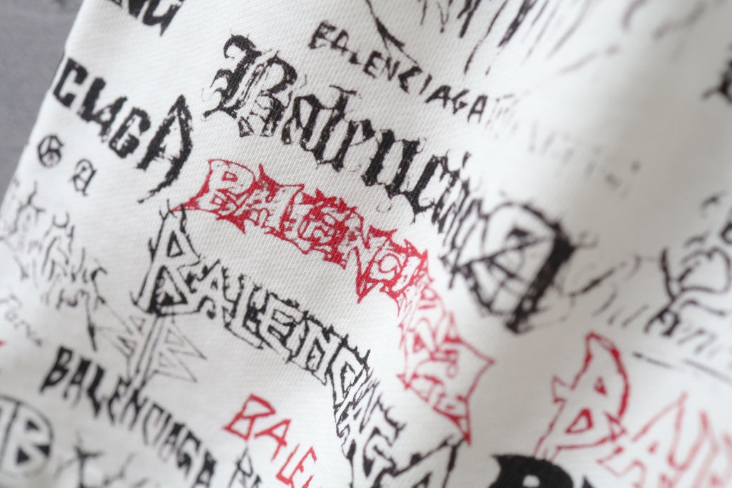 Balenciaga shorts waistband with red stamp and black script print on white