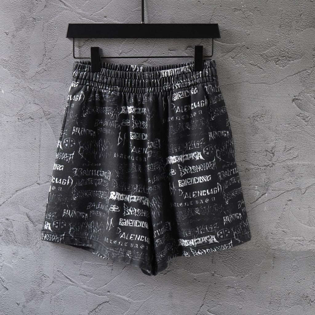 Balenciaga patterned shorts in black with white logo print and elastic waistband.