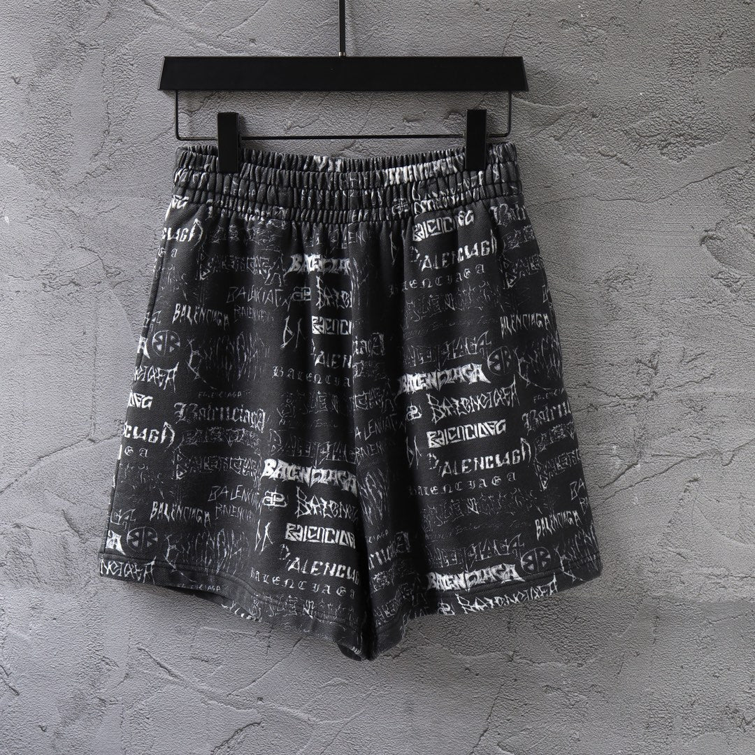 Balenciaga patterned shorts in black with white logo print and elastic waistband.