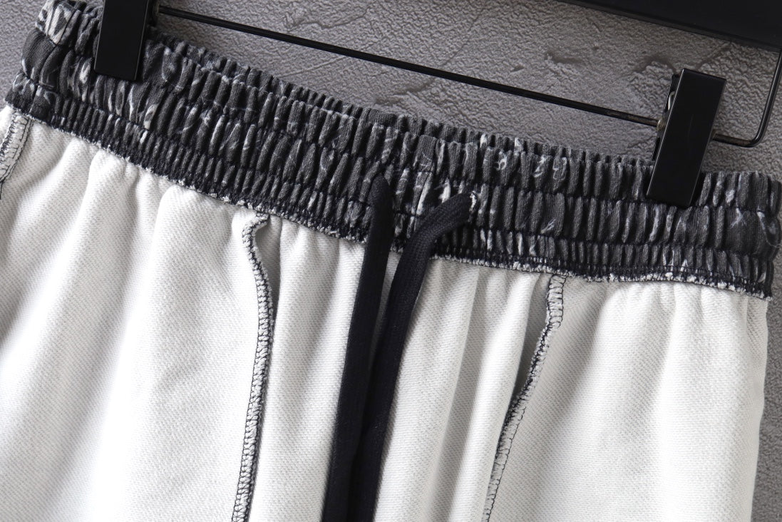 Balenciaga shorts waistband close-up: black elastic with white fabric panels.