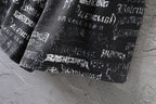Balenciaga logo-print shorts with gathered hem and white lettering pattern.