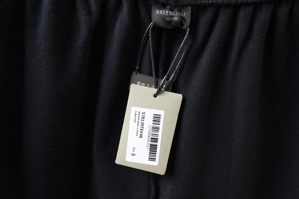 Dark navy shorts with hanging inner brand tag and barcode label