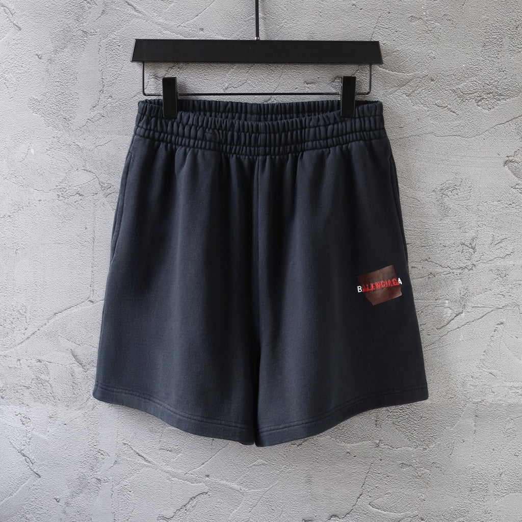 Dark navy elastic-waist shorts with side logo patch