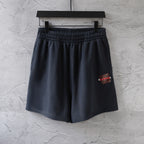 Dark navy elastic-waist shorts with side logo patch