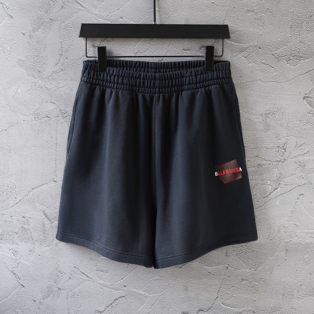 Dark navy elastic-waist shorts with side logo patch