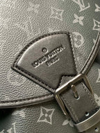 Louis Vuitton belt hardware patch with “Louis Vuitton Paris” lettering on dark strap