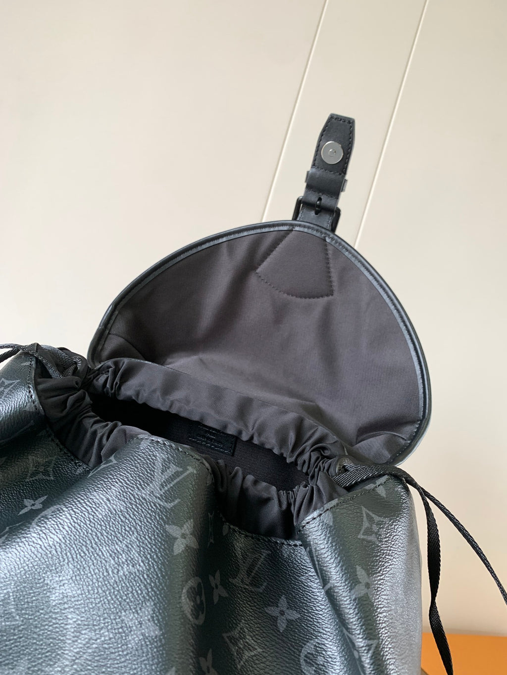 Louis Vuitton monogram backpack top opening with gathered drawstring detail