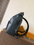 Louis Vuitton monogram backpack side view with adjustable shoulder strap and handle