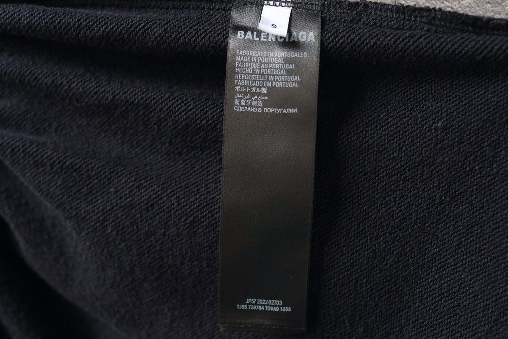 Balenciaga black shorts with interior fabric care label on seam