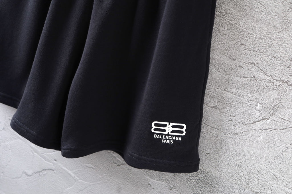 Balenciaga black shorts with white logo at side hem