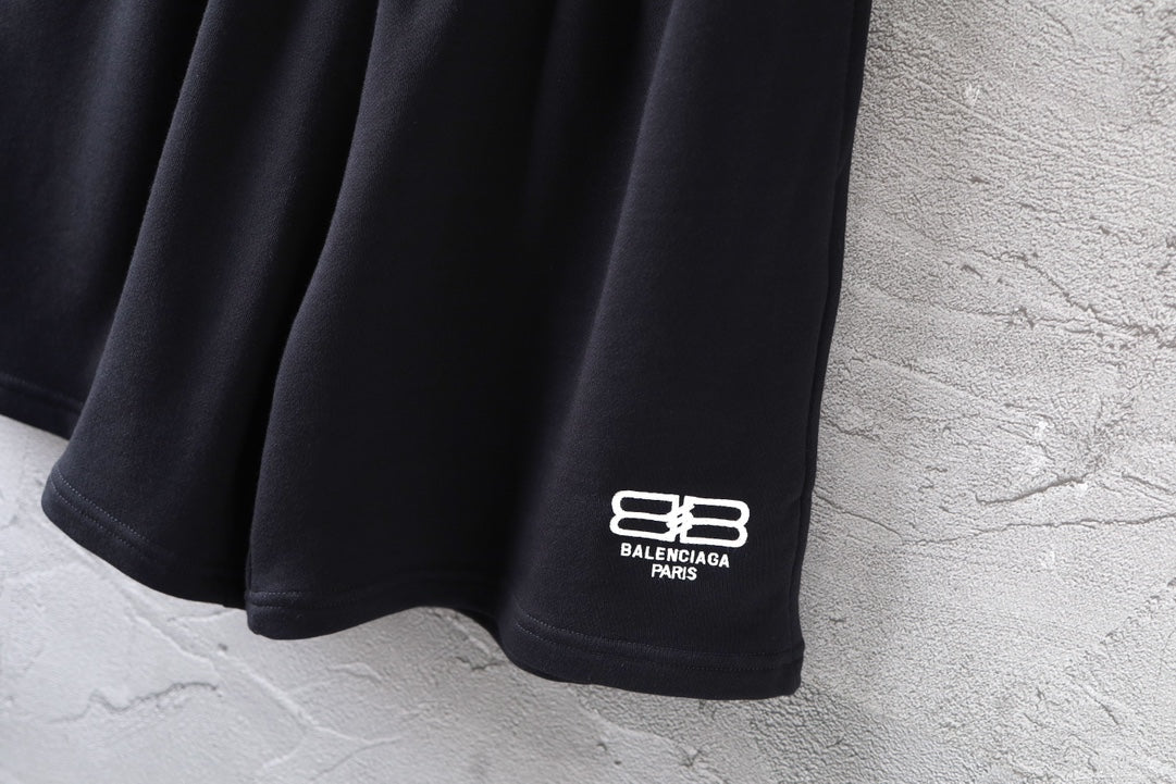 Balenciaga black shorts with white logo at side hem