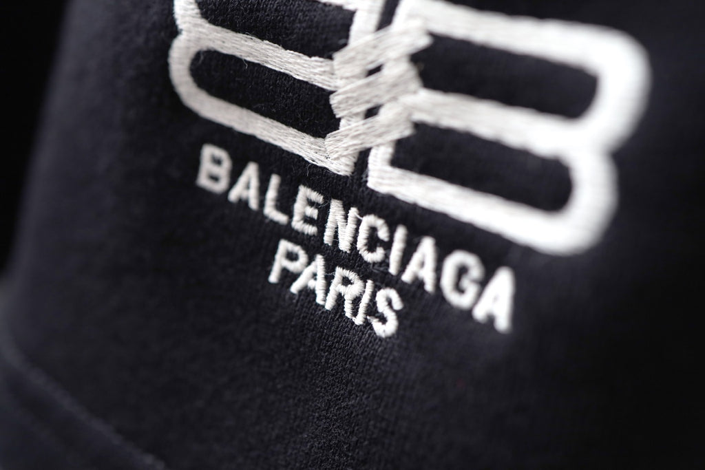 Balenciaga black shorts with large white logo and BALENCIAGA PARIS text