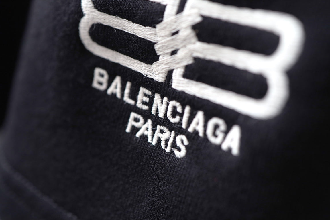 Balenciaga black shorts with large white logo and BALENCIAGA PARIS text