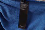 Balenciaga blue pants with black fabric care label inside waistband