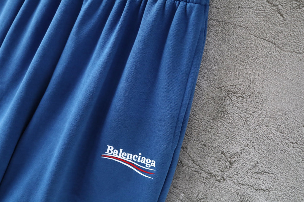 Balenciaga blue pants leg with Balenciaga logo near hem