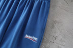 Balenciaga blue pants leg with Balenciaga logo near hem