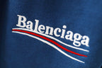 Balenciaga logo print on blue pants fabric with red and white stripes