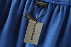 Balenciaga blue pants close-up with interior brand tag at waistband