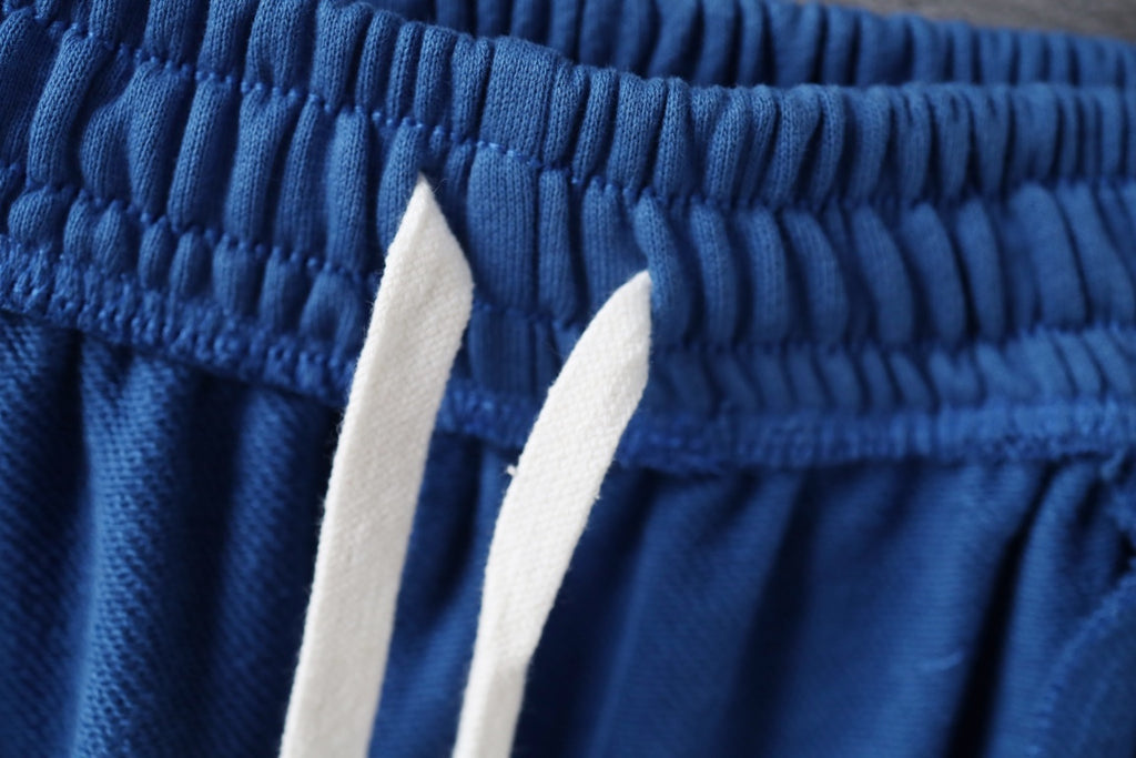 Balenciaga blue pants waistband with two white drawstring tips